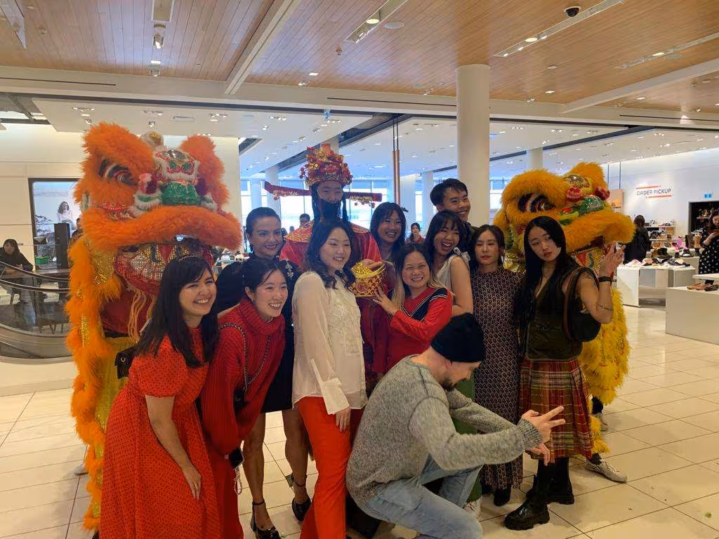 Guests posing with lions in a shopping centre