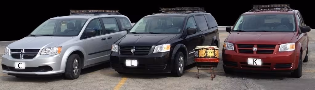 Three CLK Lion Dance vans parked side by side