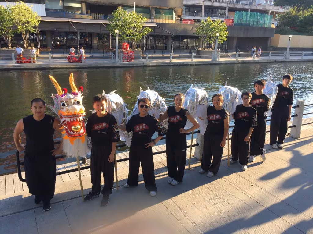 The CLK team with lions by the water